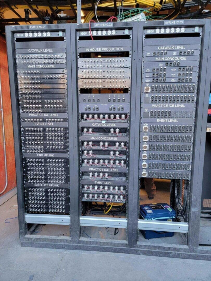 Audio equipment racks with numerous connectors.